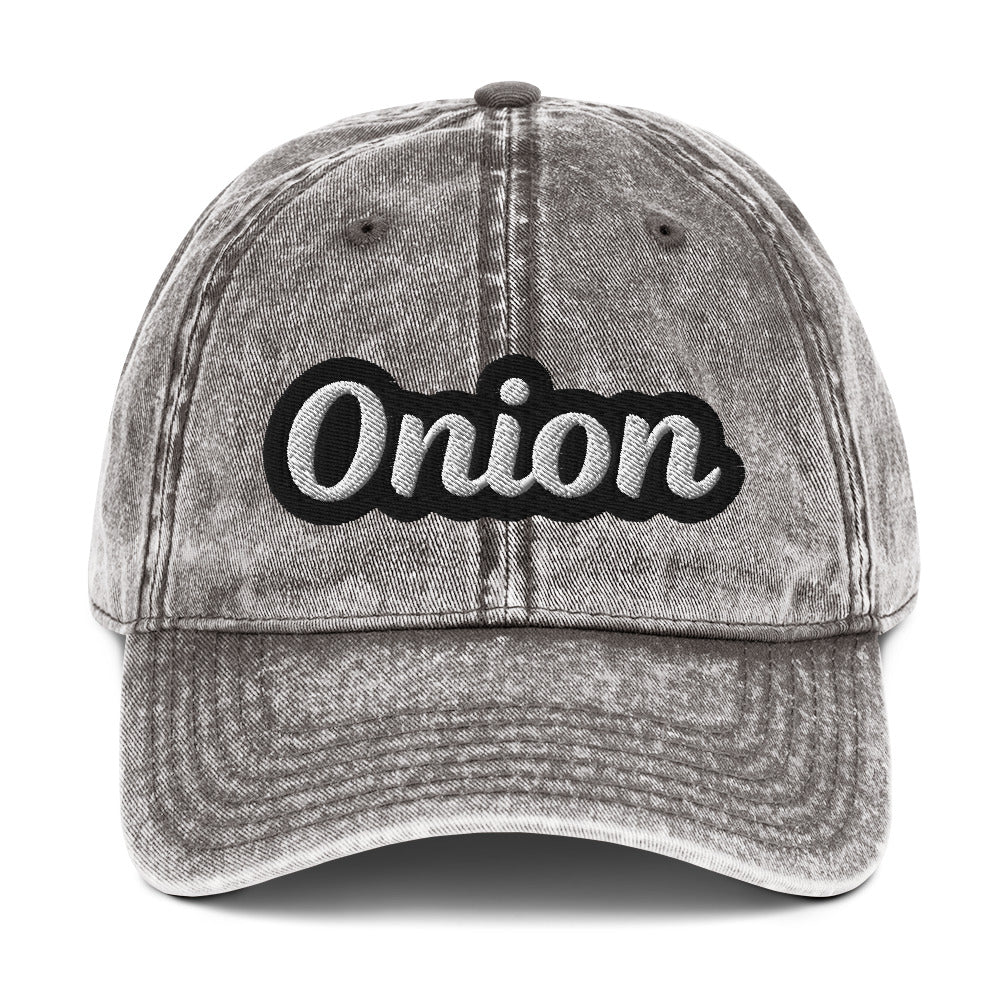 Gray onion hat from Nina's Funky Shop by ninanush - This onion dad hat is comfortable, adjustable and the perfect weird hat for everyday fashion. It has a faded vintage-style material, expertly embroidered with the word "onion". Wear this onion hat and make a statement or give it as a gift to an onion enthusiast. Celebrate your favorite foods in our funny food hats, tees and accessories.