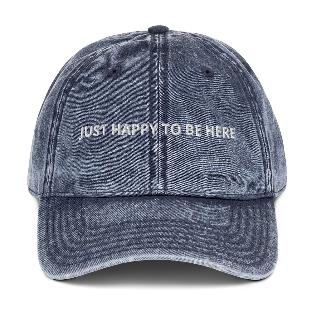 Blue Our "Just Happy to Be Here" Dad Hat is comfy, adjustable, and perfect for everyday wear. Whether you’re traveling in Kazakhstan or snacking on the couch, this embroidered baseball cap adds a positive touch to any outfit. 