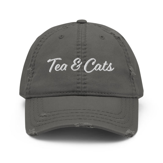 Dark Gray Tea and Cats Hat - Love cats? Tea drinker? This Tea & Cats Hat is just what you need. It's a comfortable cotton hat with an adjustable closure and "Tea & Cats", expertly embroidered on the front. Stand out in our funny apparel. It's unique, sarcastic, and perfect for everyday foodies. Designed by Nina and made just for you! 