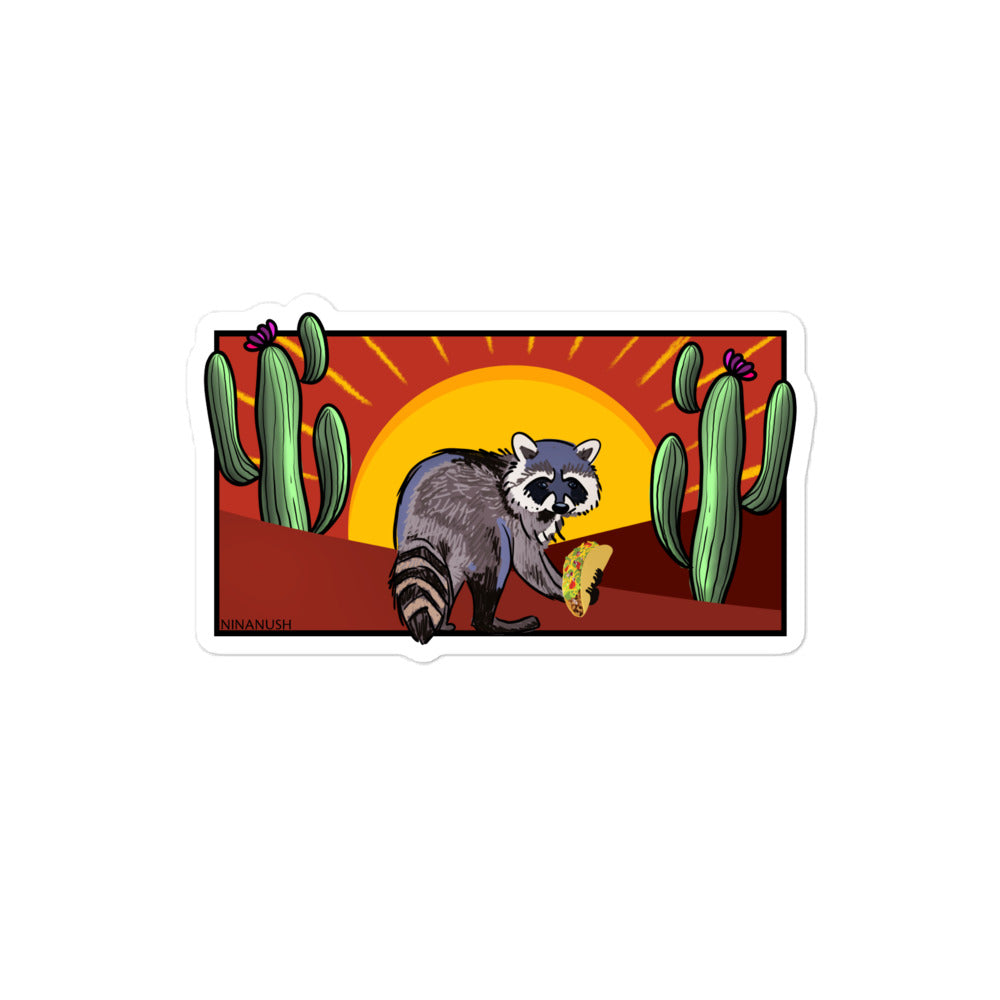 Naughty raccoon with taco sticker from Nina's Funky Shop by ninanush - The Desert Raccoon Vinyl Sticker! Crafted for raccoon enthusiasts, this unique sticker captures the charm of a naughty raccoon enjoying a taco. It's an original hand drawn design by Nina and it's made just for you. This funky raccoon sticker is the perfect for your sticker collection or gift for a raccoon lover.