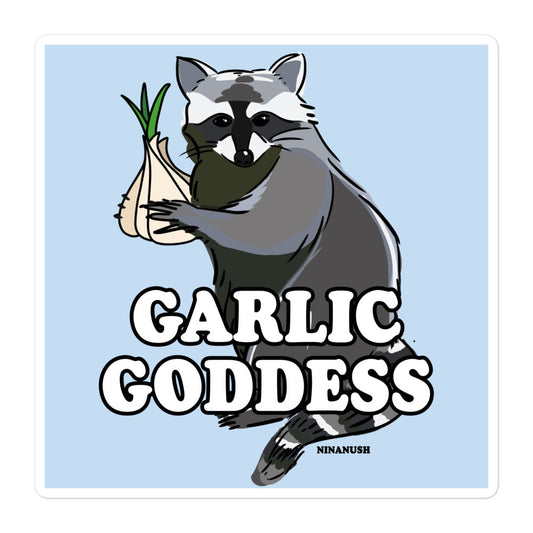 Do you love garlic? Looking for a funny gift for a raccoon lover? Introducing the Garlic Goddess Raccoon Vinyl Sticker! Designed for passionate garlic enthusiasts, this funky garlic goddess sticker features a totally unique naughty raccoon design holding a head of garlic and the words "garlic goddess" in bold letters. It's an original hand drawn design by Nina and it's made just for you. 