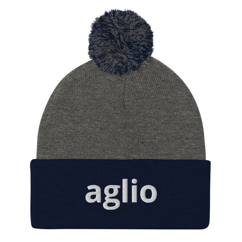 Heather gray and navy aglio beanie from Nina's Funky Shop by ninanush - An Italian garlic beanie for aglio lovers. This aglio hat is a classic pom pom beanie with a funny Italian word embroidery. The perfect cozy hat for Italians, garlic enthusiasts and foodies of all kinds. Stand out and share your love of garlic in this Italian garlic hat or give it as a cute gift for an Italian foodie.