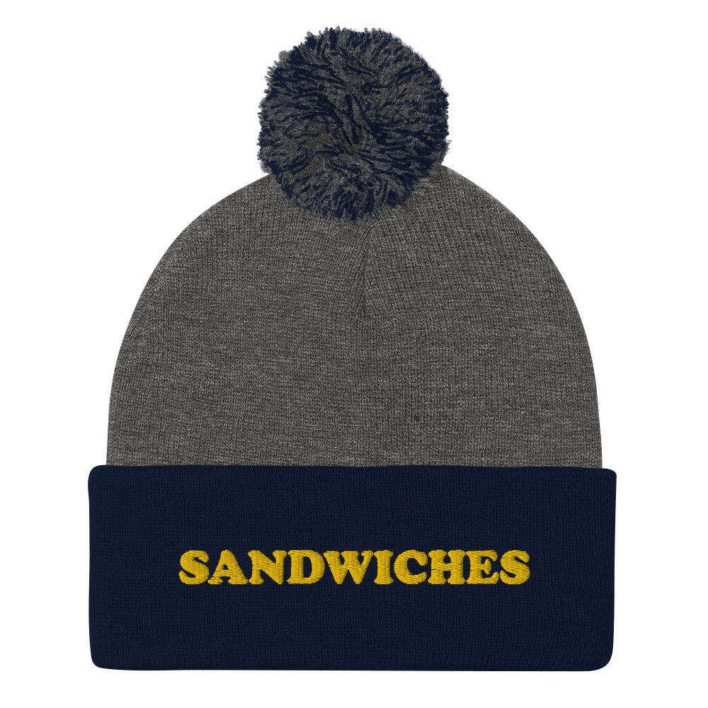 Gray and Navy Sandwiches Beanie - Love sandwiches? This sandwich hat is just for you! It's a warm and cozy beanie with a classic pom pom on top and "sandwich", expertly embroidered on the front. Designed by Nina and made just for you! Looking for something personalized? A different embroidery color? Shoot us an email or check out our customizable apparel! 
