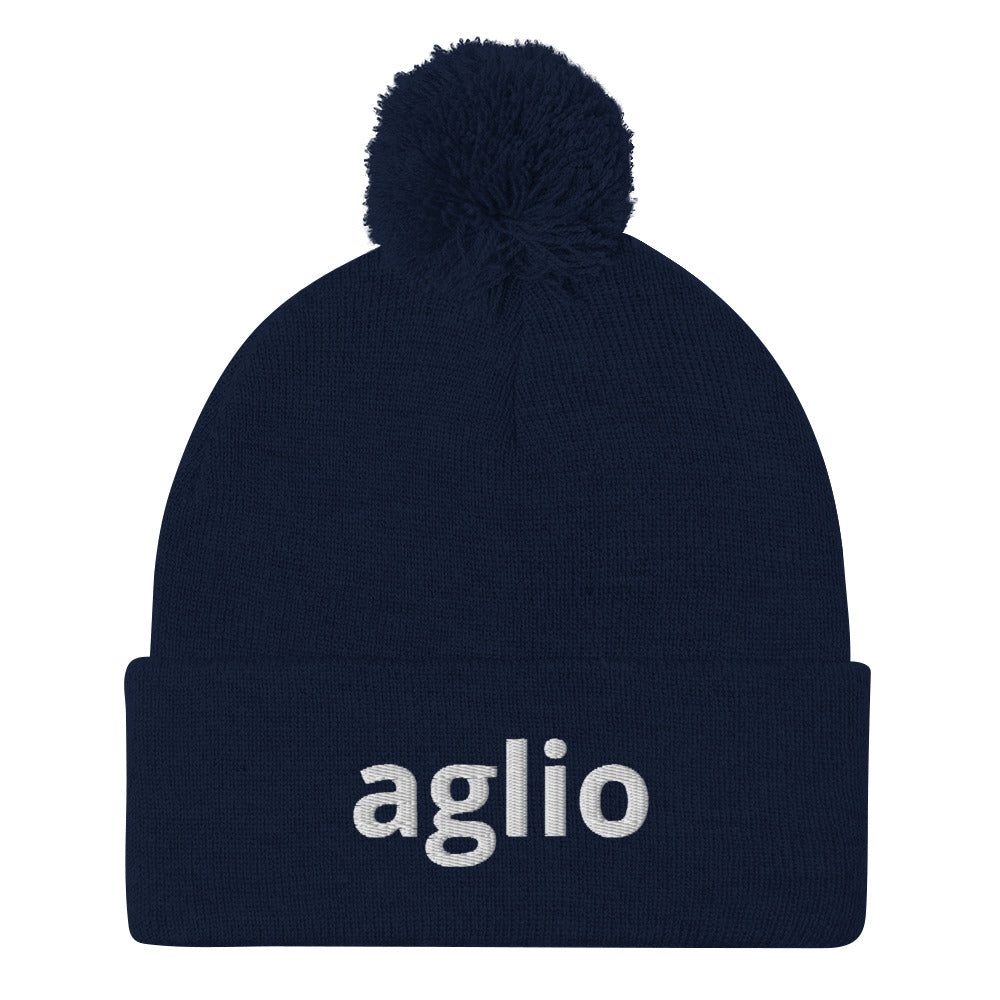 Navy aglio beanie from Nina's Funky Shop by ninanush - An Italian garlic beanie for aglio lovers. This aglio hat is a classic pom pom beanie with a funny Italian word embroidery. The perfect cozy hat for Italians, garlic enthusiasts and foodies of all kinds. Stand out and share your love of garlic in this Italian garlic hat or give it as a cute gift for an Italian foodie.