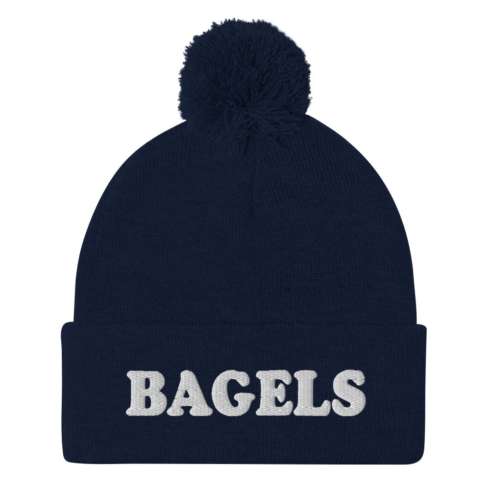 Navy Bagels Beanie -Are you a bagel enthusiast? Looking for a gift for a foodie? Our Bagels Beanie is comfortable, cozy and expertly embroidered just for you. It's a funny beanie with a pom pom on top, perfect for everyday streetwear for bagel lovers and foodies of all kinds.