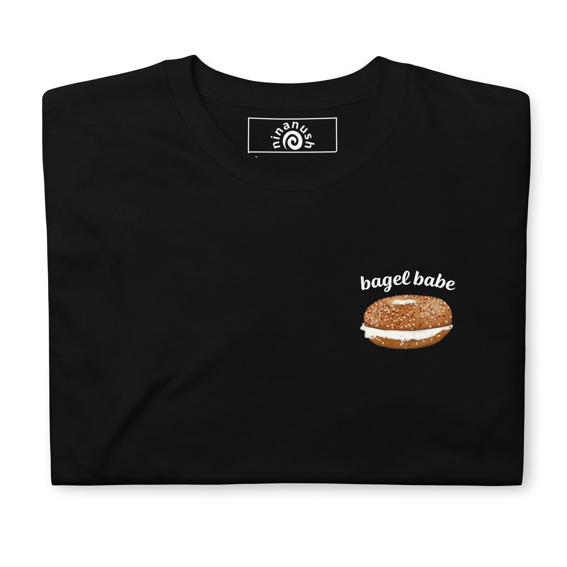 Black bagel babe everything bagel t-shirt, printed logo style from Nina's Funky Shop by ninanush - Are you a bagel enthusiast? Looking for a fun gift for a bagel lover? Our bagel babe shirt is just what you need. It's a unisex, crew neck T-shirt with a an everything bagel and "bagel babe", expertly printed on the front. Eat your favorite bagel in this unique foodie t-shirt, it's designed by Nina and made just for you.