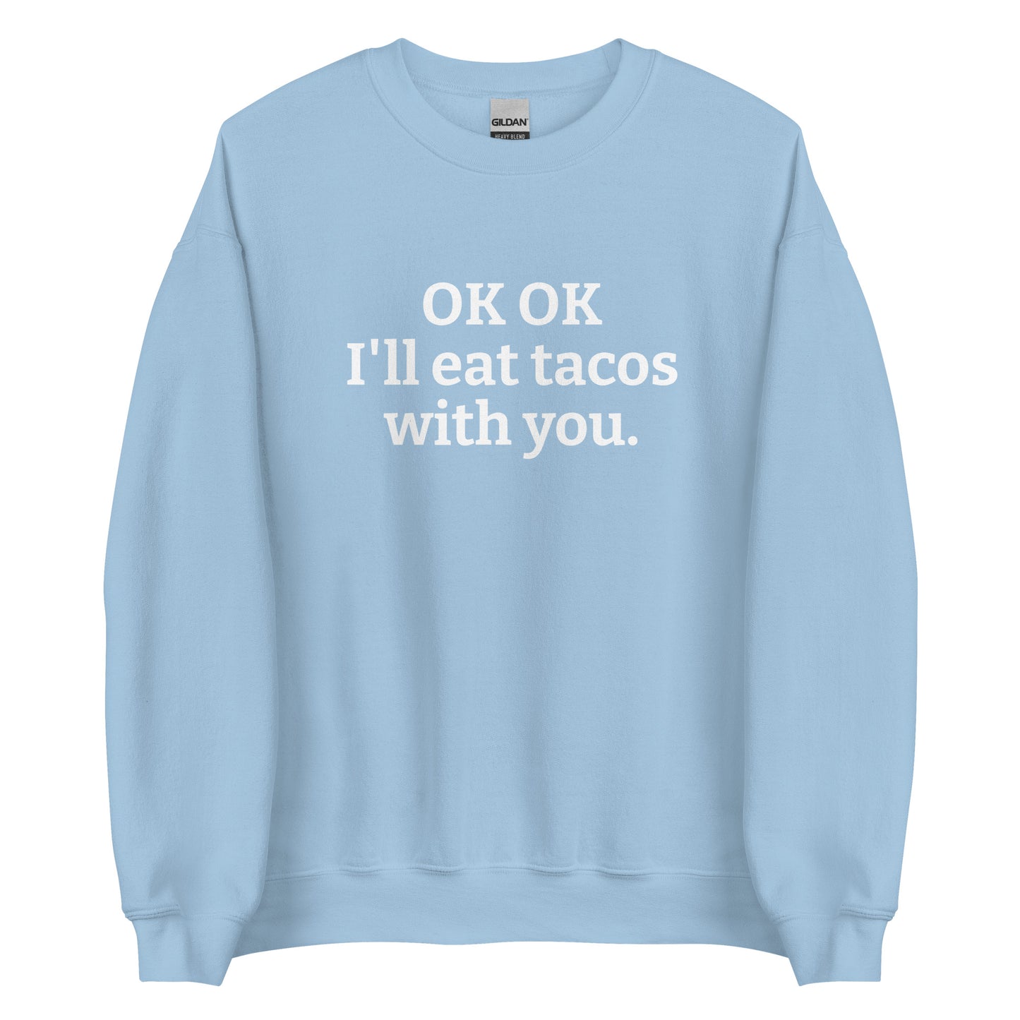 Light Blue OK OK I'll eat tacos with you Sweatshirt from Nina's Funky Shop by ninanush - Do you love tacos? Looking for a funny gift for a friend? Our taco lover crewneck sweatshirt is just what you need. It's a unisex taco sweatshirt with "OK OK I'll eat tacos with you." on the front. A funny taco sweatshirt for cozy nights in and quirky streetwear. This taco enthusiast sweatshirt is made just for you.
