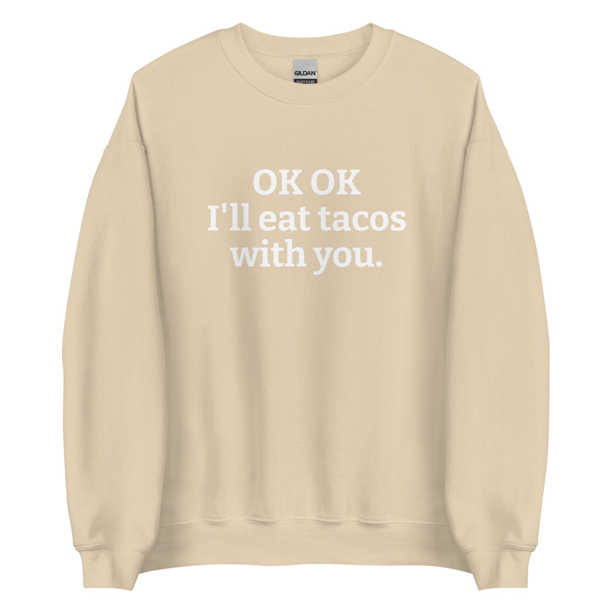 Beige OK OK I'll eat tacos with you Sweatshirt from Nina's Funky Shop by ninanush - Do you love tacos? Looking for a funny gift for a friend? Our taco lover crewneck sweatshirt is just what you need. It's a unisex taco sweatshirt with "OK OK I'll eat tacos with you." on the front. A funny taco sweatshirt for cozy nights in and quirky streetwear. This taco enthusiast sweatshirt is made just for you.