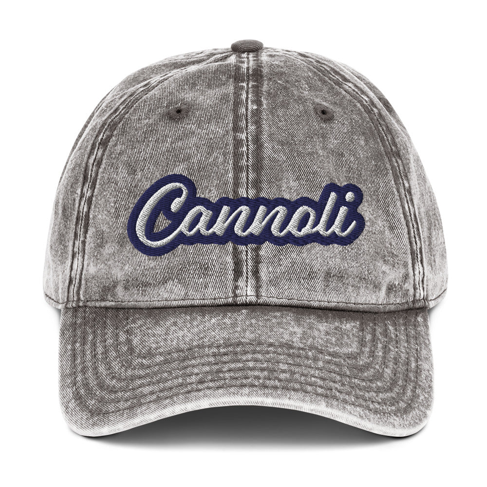 Gray cannoli hat from Nina's Funky Shop by ninanush - A unique dad can designed for cannoli lovers and foodies. Eat your favorite cannoli in style and show off your love for this classic Italian dessert in our unique foodie dad hat. This cannoli hat is has a washed out vintage style and a white and blue embroidery. Perfect for cannoli lovers and foodies of all kinds. 