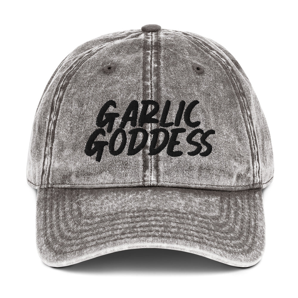 Gray garlic goddess dad hat from Nina's Funky Shop by ninanush - This unique garlic dad hat comes in a variety of colors with Garlic Goddess on the front. Our Garlic Goddess hat was designed by Nina especially for garlic enthusiasts and foodies of all kinds. Stay funky and eat garlic in this embroidered vintage style dad hat or give it as a unique gift for a garlic lover.
