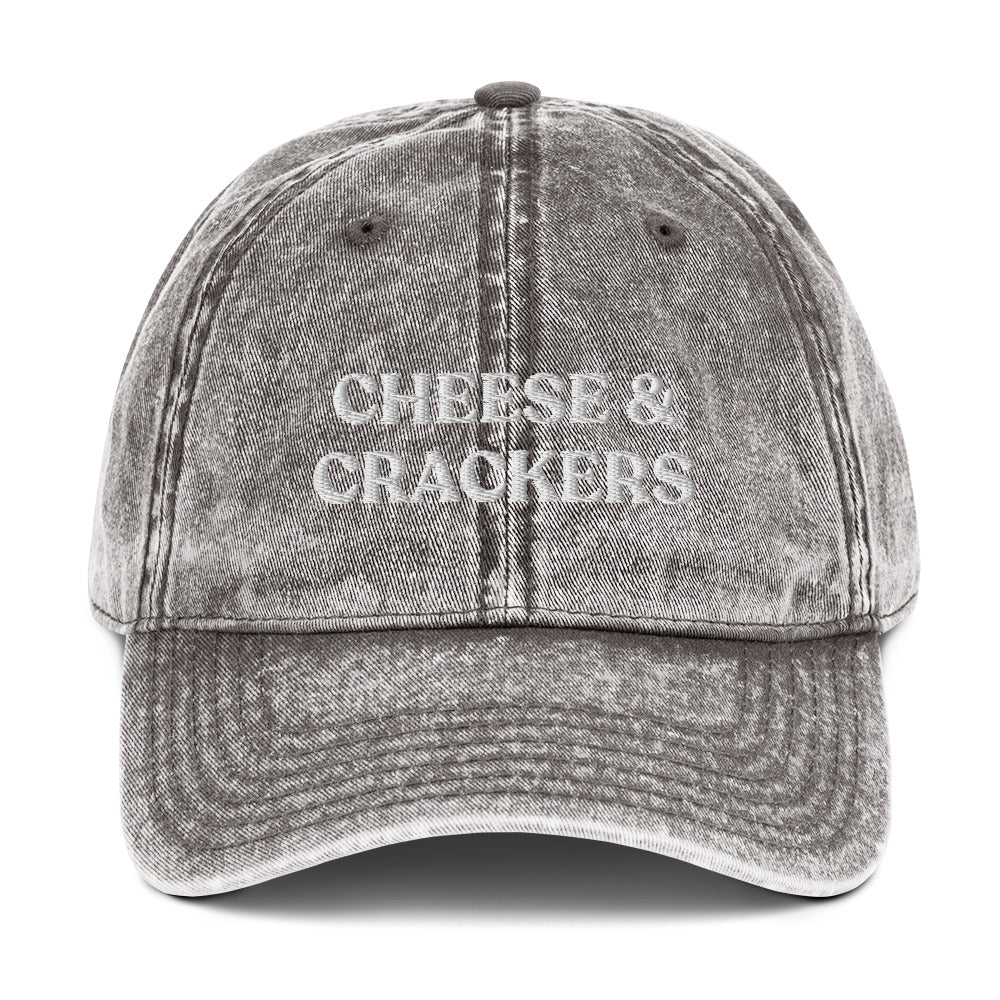 Gray cheese and crackers hat - Our Cheese & Crackers Hat is made of comfortable cotton and expertly embroidered just for you. It's a classic dad hat that's perfect for everyday streetwear that will have people asking "Where'd you get that hat?" Make a statement in this funny foodie dad hat.