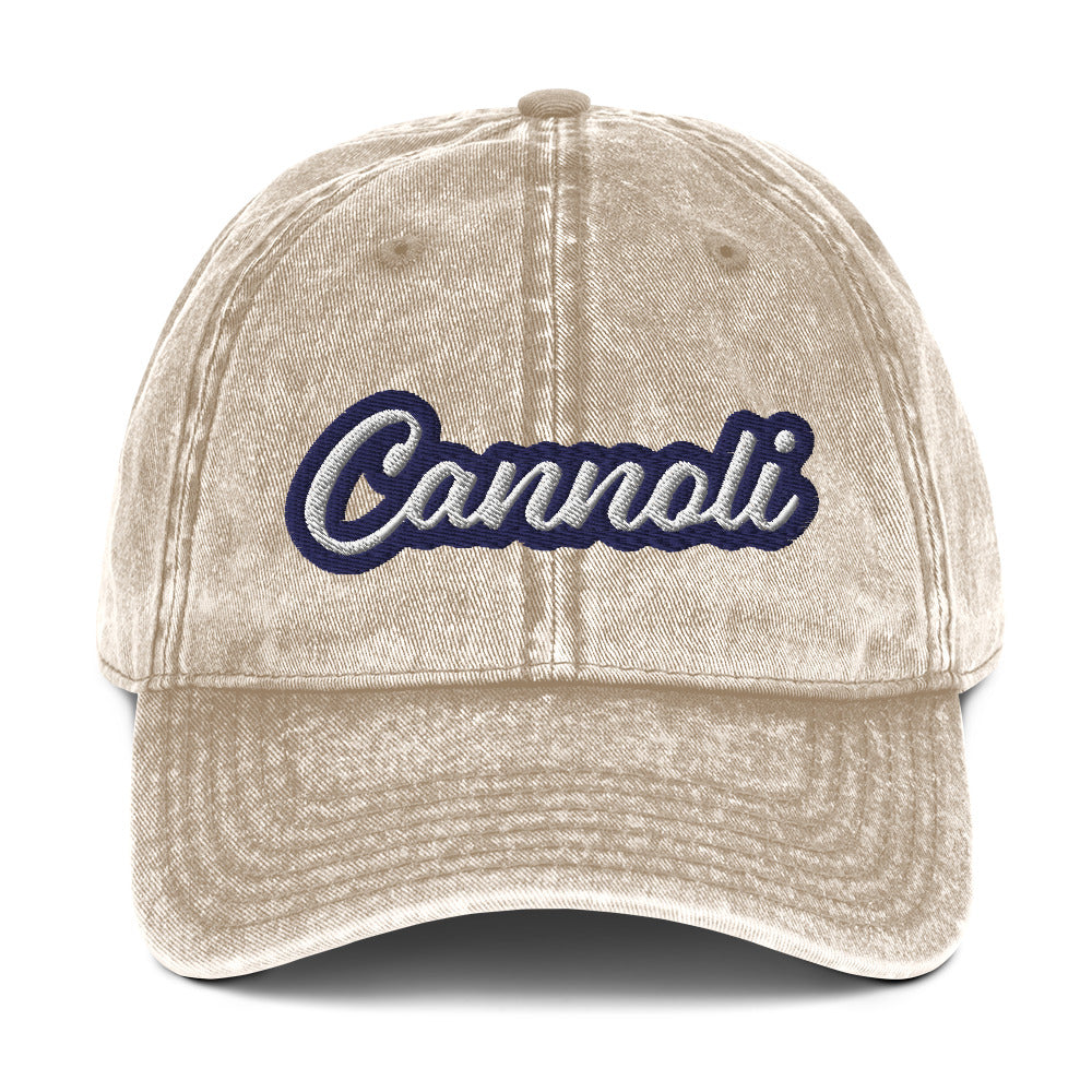 Tan cannoli hat from Nina's Funky Shop by ninanush - A unique dad can designed for cannoli lovers and foodies. Eat your favorite cannoli in style and show off your love for this classic Italian dessert in our unique foodie dad hat. This cannoli hat is has a washed out vintage style and a white and blue embroidery. Perfect for cannoli lovers and foodies of all kinds. 