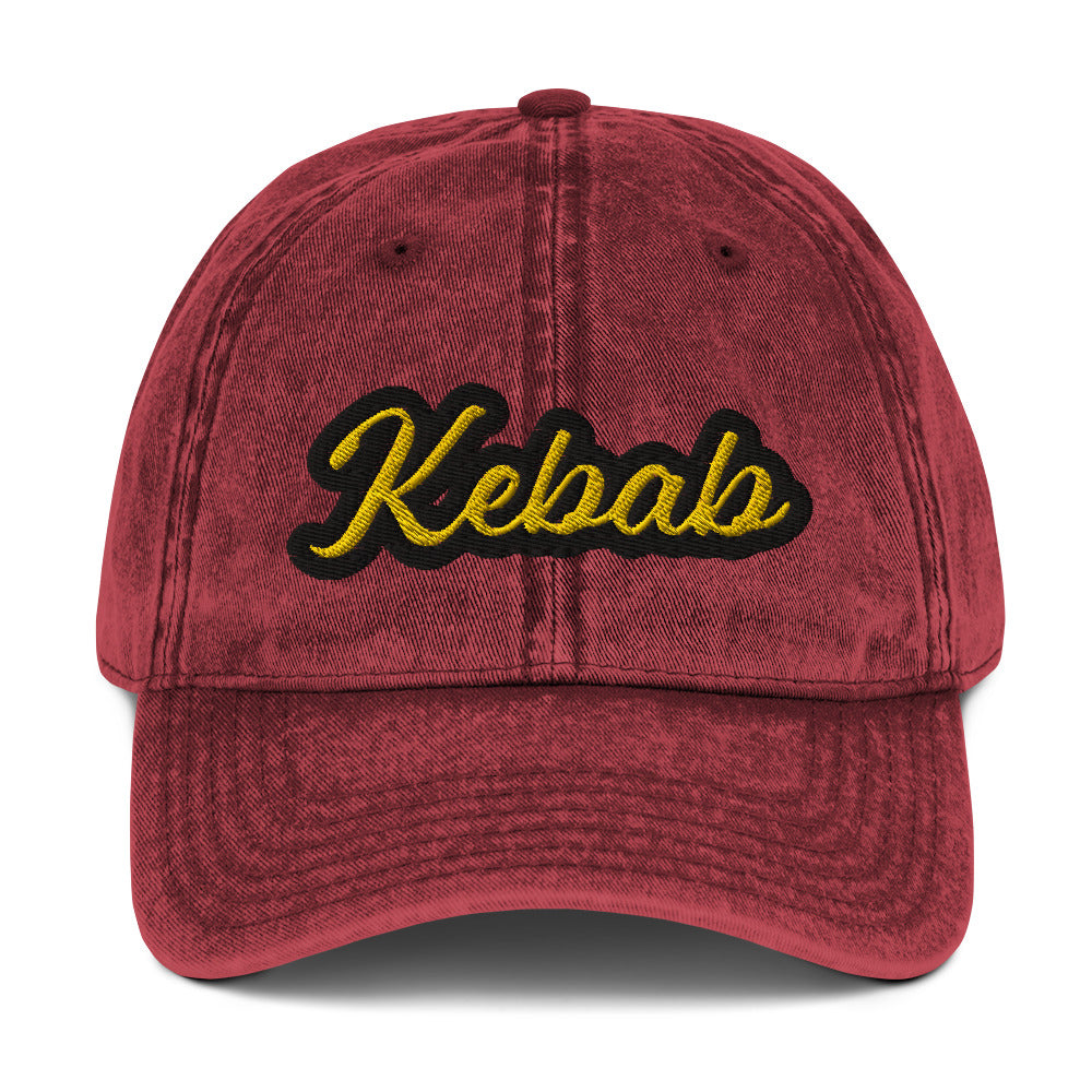 Maroon kebab dad hat - This kebab dad hat, made of cotton, is designed for kebab enthusiasts. The hat showcases a washed-out cotton material with vintage-style embroidery. It's the ideal funny food hat for both kebab lovers and Middle Eastern foodies. This kebab hat is a unique, statement accessory for foodies or gift for kebab aficionados. 