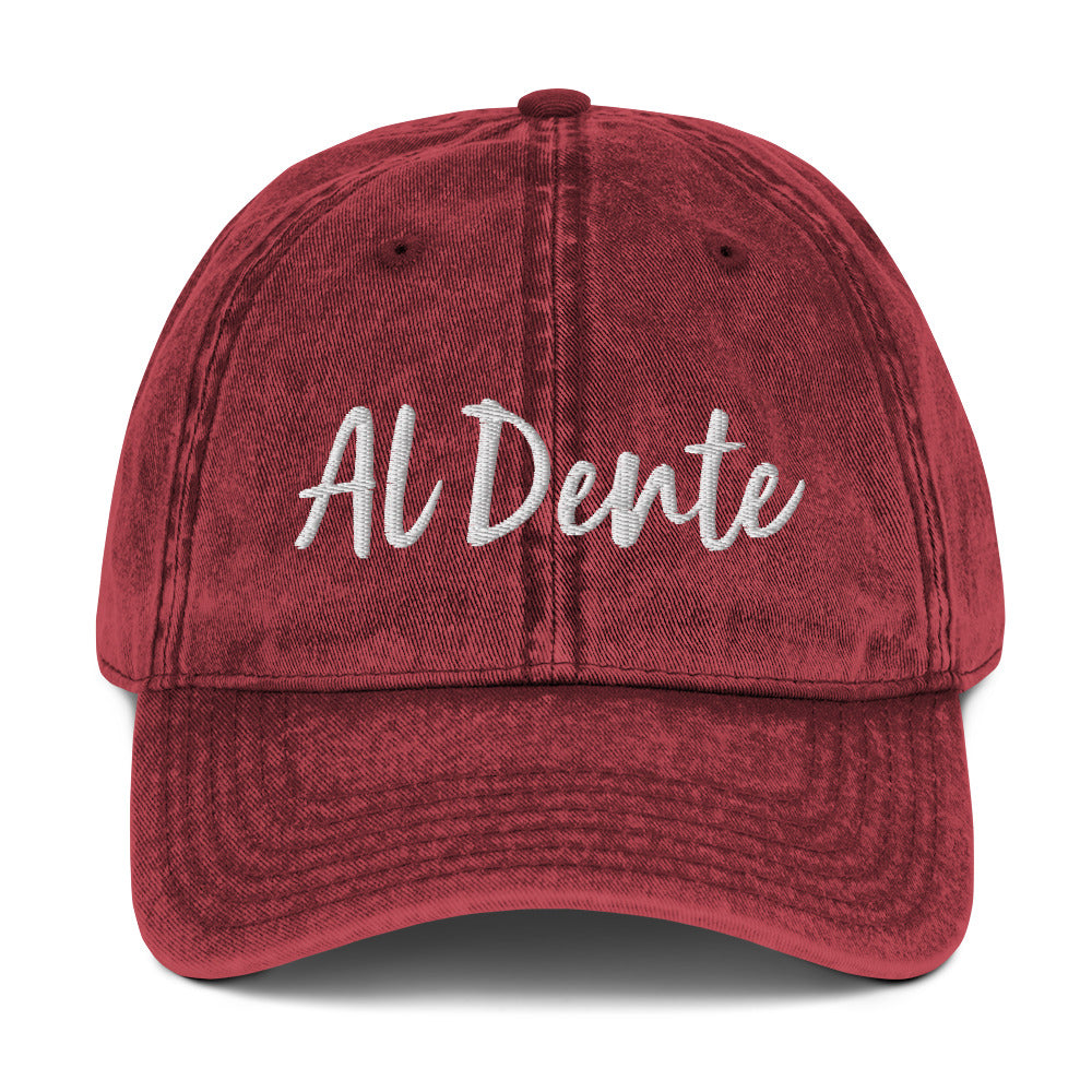 Maroon Al Dente Hat - This Al Dente Hat is perfect for pasta lovers and foodies of all kinds. It's comfortable, has an adjustable closure, and comes in a variety of colors with "Al Dente", expertly embroidered on the front. Celebrate your favorite foods in our funky foodie clothing and accessories. Designed by Nina and made just for you!