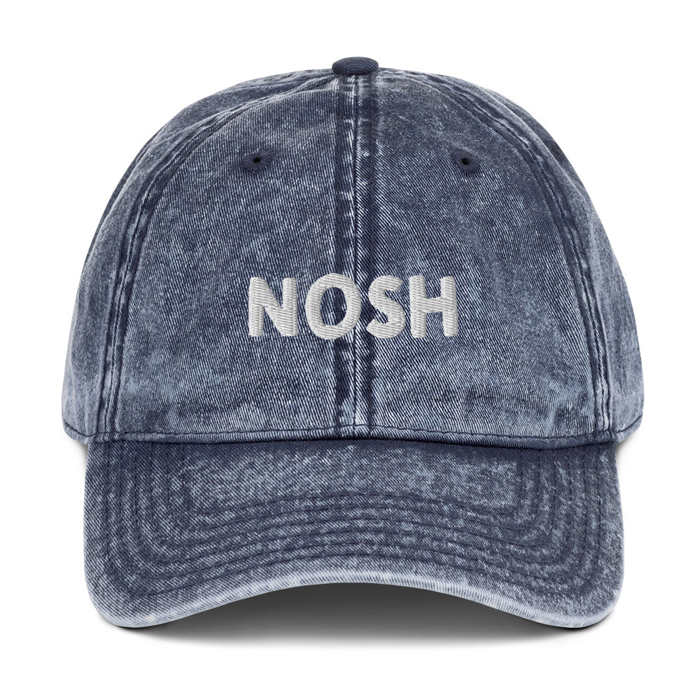 Navy nosh hat - A nosh hat with a simple text embroidery, vintage-style faded material and it comes in a variety of colors. It's a funny dad hat for foodies or a gift for noshers and food enthusiasts. Nosh on your favorite foods in this yiddish word hat. It's a perfect hat for everyday wear and a unique dad hat for snack lovers.