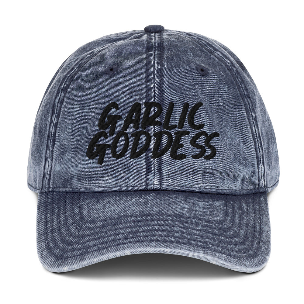 Blue garlic goddess dad hat from Nina's Funky Shop by ninanush - This unique garlic dad hat comes in a variety of colors with Garlic Goddess on the front. Our Garlic Goddess hat was designed by Nina especially for garlic enthusiasts and foodies of all kinds. Stay funky and eat garlic in this embroidered vintage style dad hat or give it as a unique gift for a garlic lover.