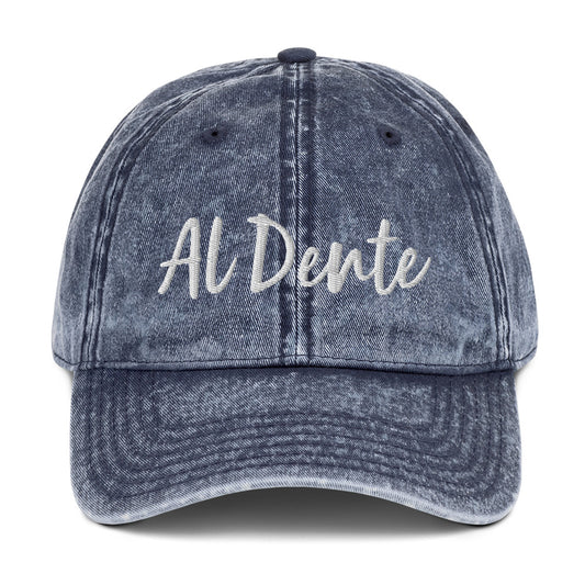 Blue Al Dente Hat - This Al Dente Hat is perfect for pasta lovers and foodies of all kinds. It's comfortable, has an adjustable closure, and comes in a variety of colors with "Al Dente", expertly embroidered on the front. Celebrate your favorite foods in our funky foodie clothing and accessories. Designed by Nina and made just for you! 