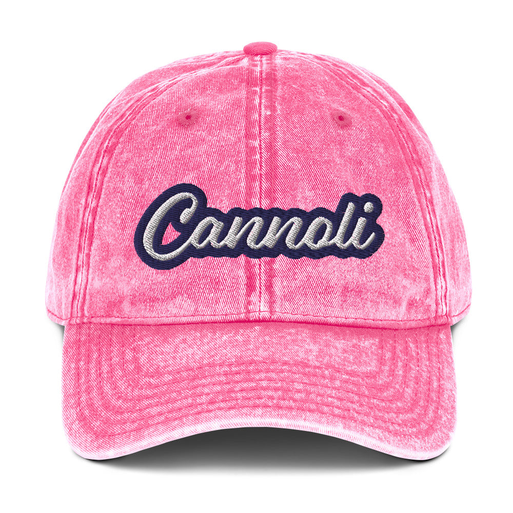 Pink cannoli hat from Nina's Funky Shop by ninanush - A unique dad can designed for cannoli lovers and foodies. Eat your favorite cannoli in style and show off your love for this classic Italian dessert in our unique foodie dad hat. This cannoli hat is has a washed out vintage style and a white and blue embroidery. Perfect for cannoli lovers and foodies of all kinds. 