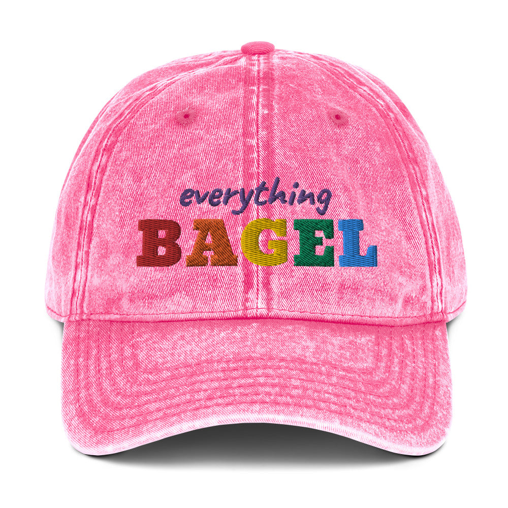 Pink Pride Hat for Bagel Lovers - Our Everything Bagel Pride Hat is comfortable, has an adjustable closure, and comes in a variety of colors with a funny rainbow design for pride, expertly embroidered on the front. The perfect hat for pride month and for bagel lovers or all kinds. Celebrate your favorite foods in our funky foodie clothing and accessories. Designed by Nina and made just for you!