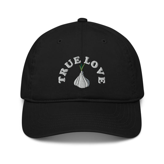 The 'True Love' garlic hat is perfect for foodies and garlic addicts. If you love garlic, it's time to show it in this funky and unique dad hat. The eco friendly garlic hat is cute, unusual and 100% organic cotton. Funky fashion, foodie beanies, garlic hats, weird vegan clothing and more. Unique designs for everyone. 