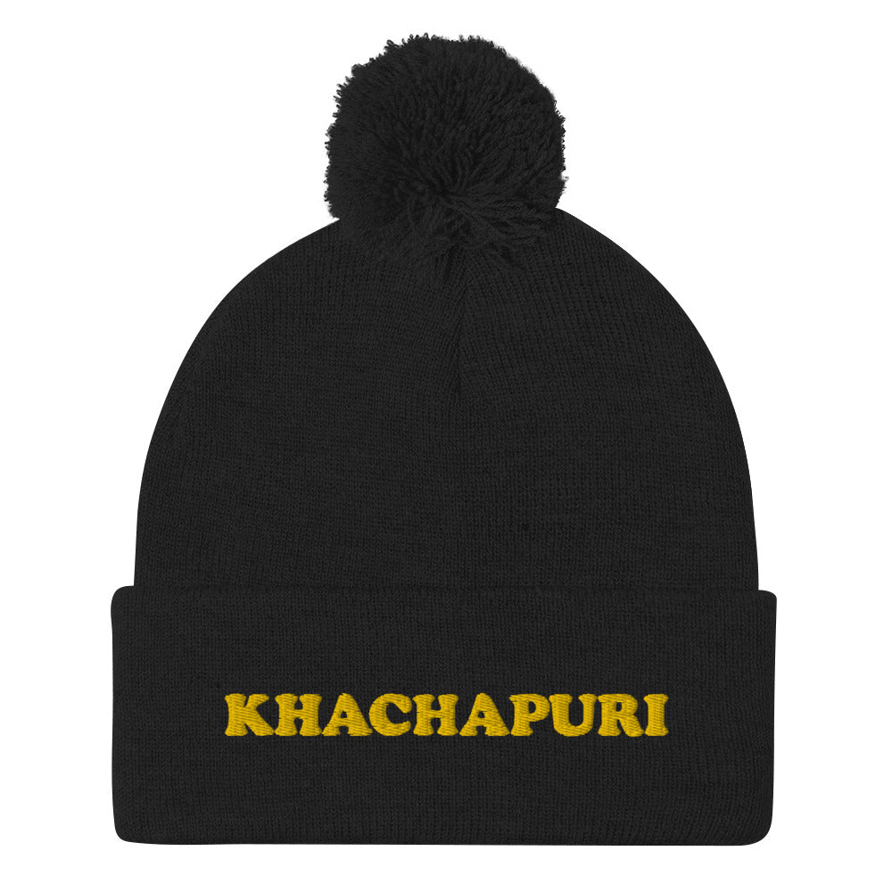 Black beanie with khachapuri emboidery - We love khachapuri! This khachapuri hat is a comfortable and unusual foodie beanie with a classic pom pom on top and a funky yellow embroidery. The beanie is cozy and just what every foodie and khachapuri lover needs. Celebrate your love for khachapuri and Georgean food in this this funky food beanie hat. 