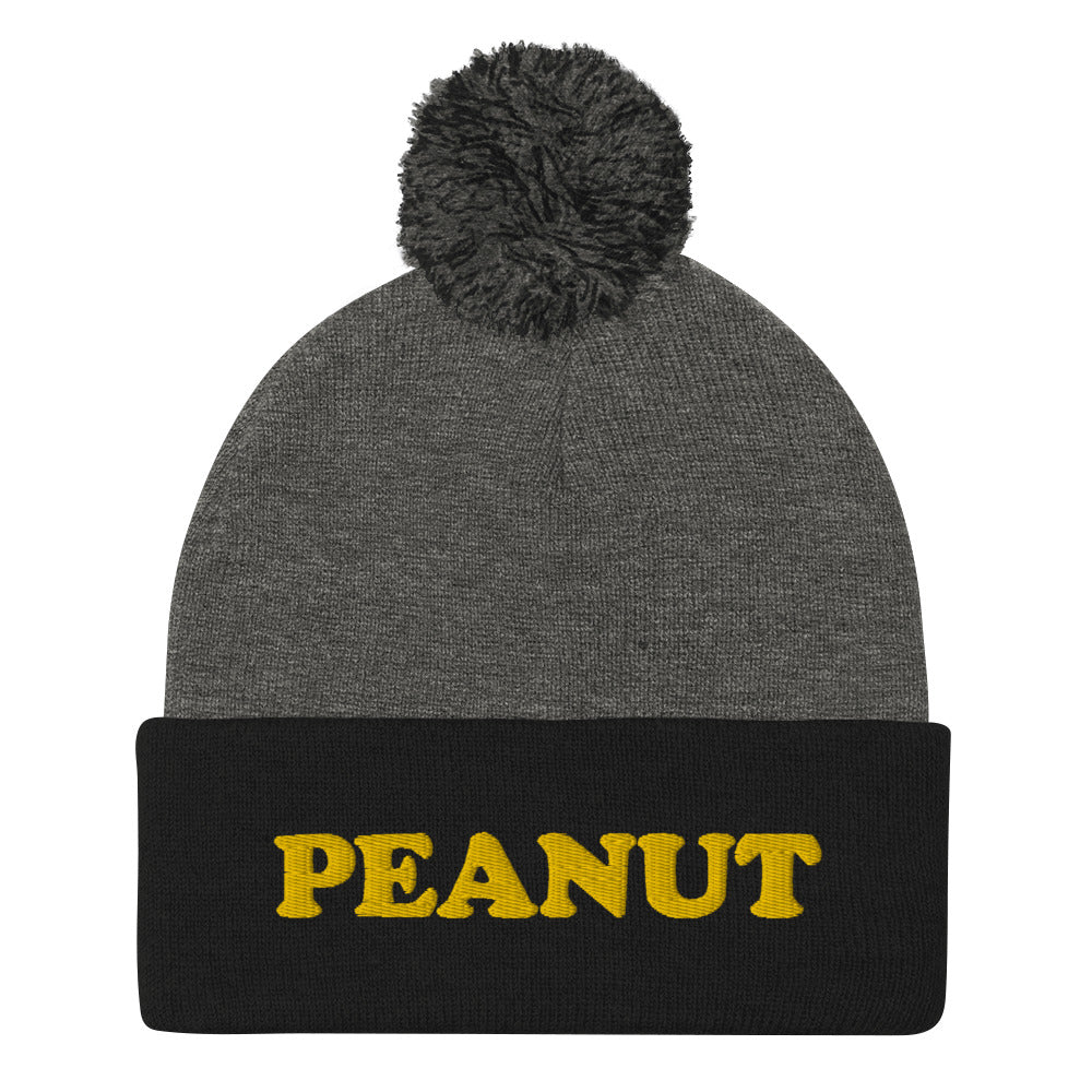 This "PEANUT" beanie hat is a perfect warm and cozy hat for cold weather. It's a classic beanie with a pom pom on top and a unique foodie embroidery. Our peanut beanie hat is part of our foodie clothing collection. Celebrate your favorite foods in our funky foodie beanies, weird hats, creative artsy hoodies, vegan tees and more