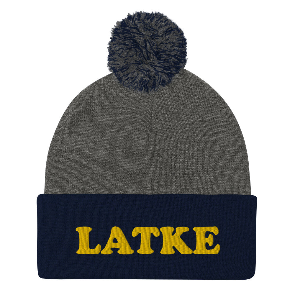 Gray and navy Hanukkah beanie with latke embroidery - What's your favorite Jewish food? If you love latkes, now you can make your favorite latke recipe and wear your latke beanie, too. It's the perfect Jewish food hat for holiday parties. Celebrate your favorite Jewish foods in our unusual foodie streetwear. This latke beanie is exactly what every Jewish foodie needs.