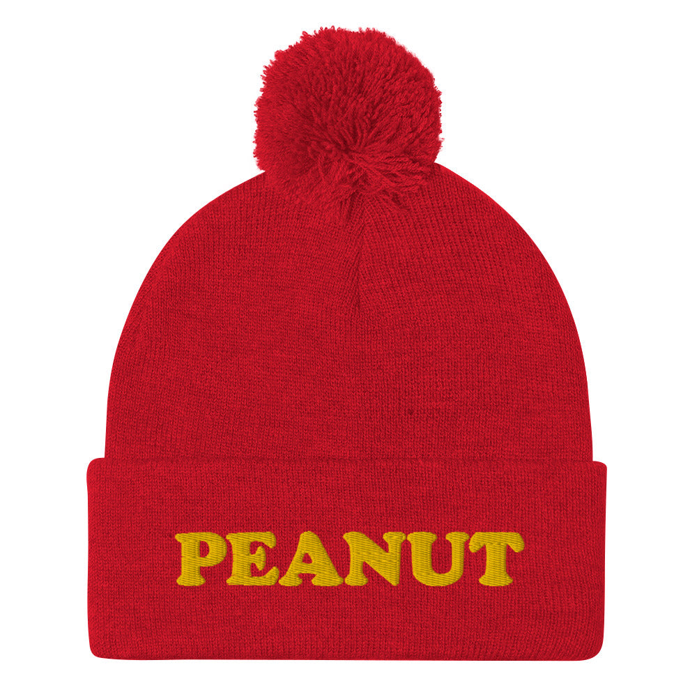 This "PEANUT" beanie hat is a perfect warm and cozy hat for cold weather. It's a classic beanie with a pom pom on top and a unique foodie embroidery. Our peanut beanie hat is part of our foodie clothing collection. Celebrate your favorite foods in our funky foodie beanies, weird hats, creative artsy hoodies, vegan tees and more